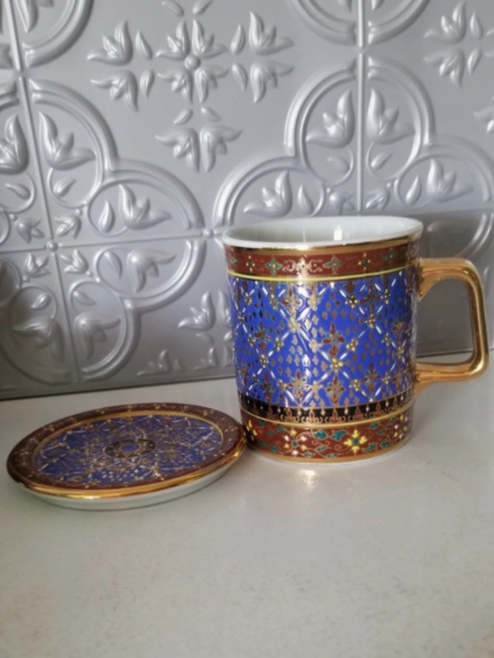 Thai Benjarong hand-painted porcelain mug set with a matching saucer